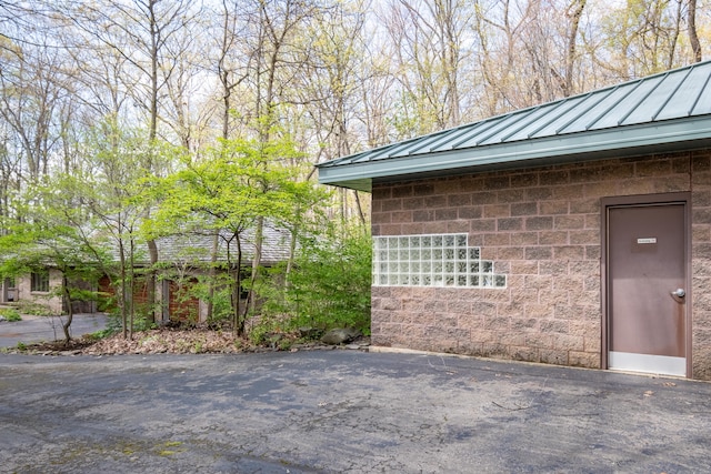 exterior space featuring metal roof and a standing seam roof