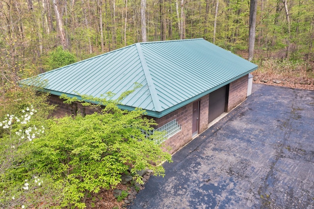 exterior space with a forest view