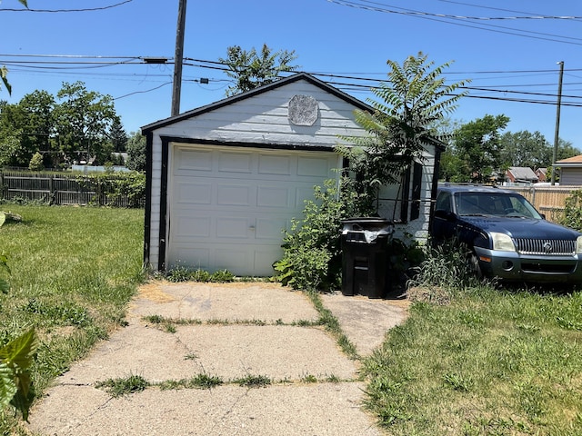 garage featuring a yard