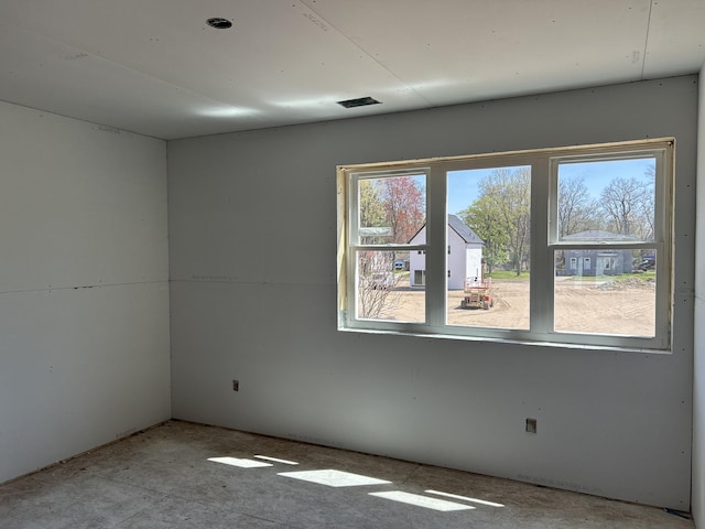 spare room featuring a healthy amount of sunlight
