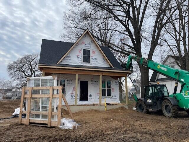 property under construction featuring covered porch