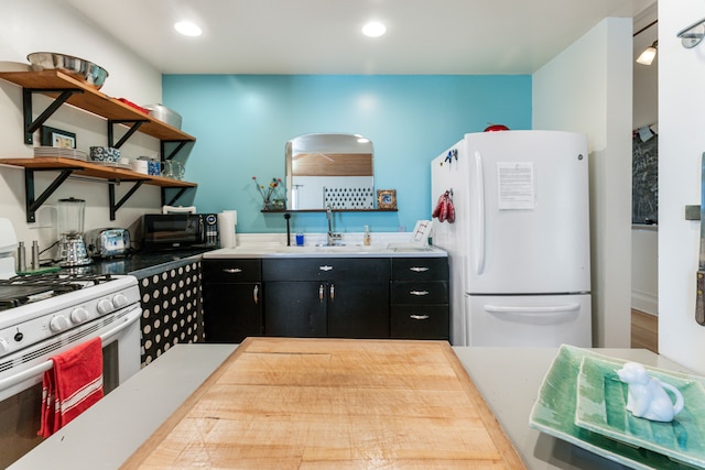 kitchen with sink and white appliances