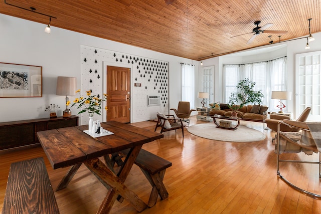 living room featuring wood ceiling, ceiling fan, a wall mounted air conditioner, and light wood-type flooring