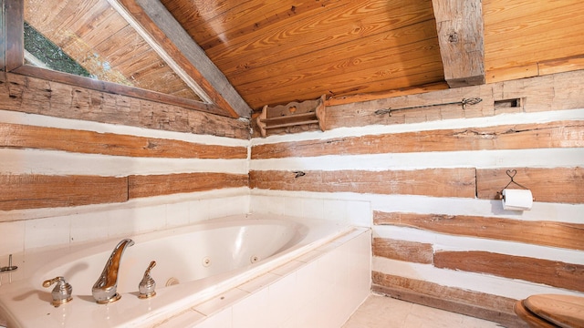 bathroom with tile patterned floors, lofted ceiling, tiled tub, and wooden ceiling