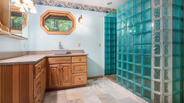 bathroom with vanity and a shower