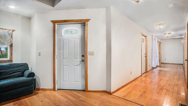 foyer with light hardwood / wood-style floors