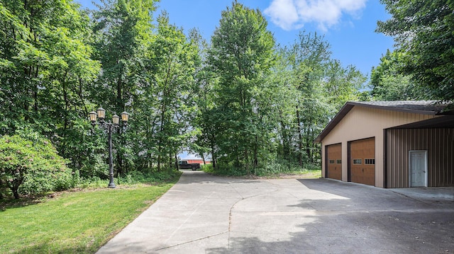 exterior space featuring a garage and an outdoor structure