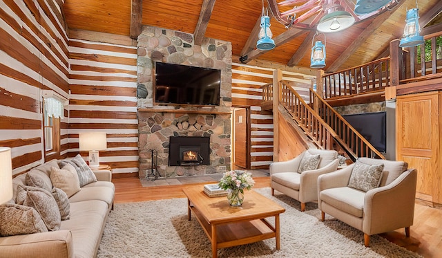 living room with hardwood / wood-style flooring, wood ceiling, and lofted ceiling with beams