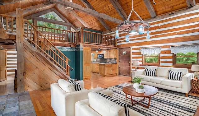 living room with beam ceiling, high vaulted ceiling, wooden ceiling, and light wood-type flooring