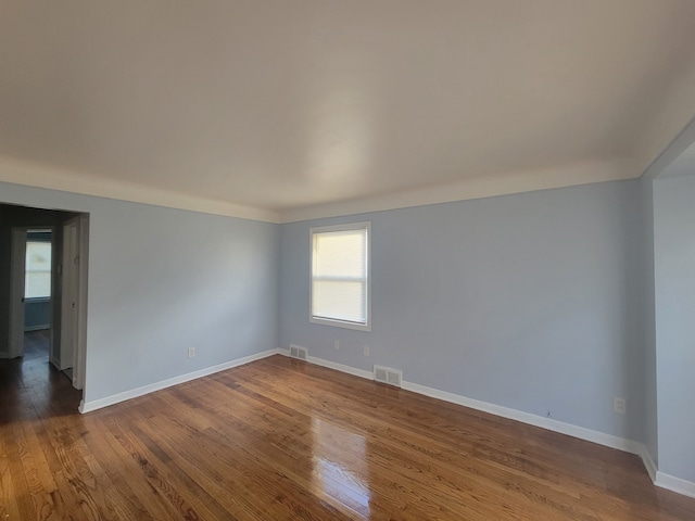 spare room featuring hardwood / wood-style flooring