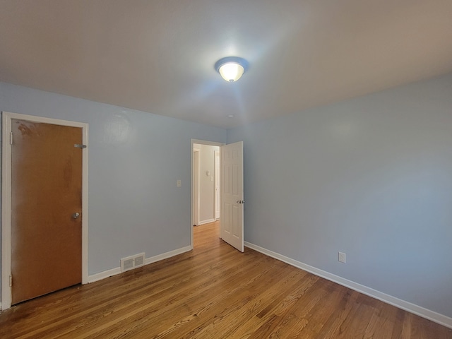 spare room with light wood-type flooring