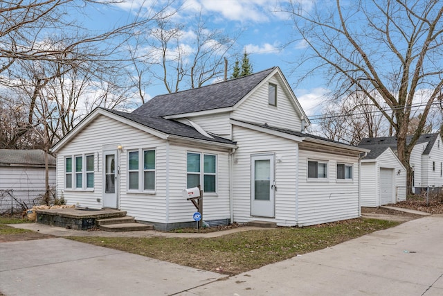 view of front of property with an outbuilding and a garage