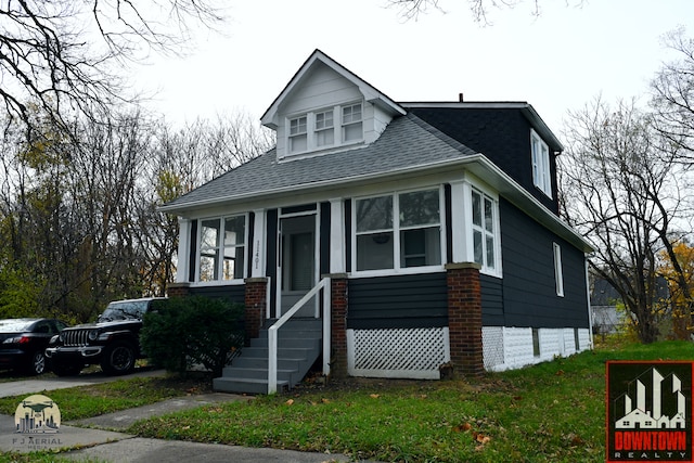 view of front facade featuring a sunroom