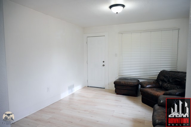 living area with light hardwood / wood-style floors