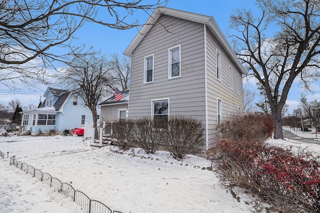 view of snow covered house