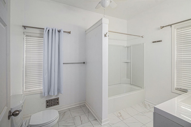 full bathroom with ceiling fan, vanity,  shower combination, and toilet