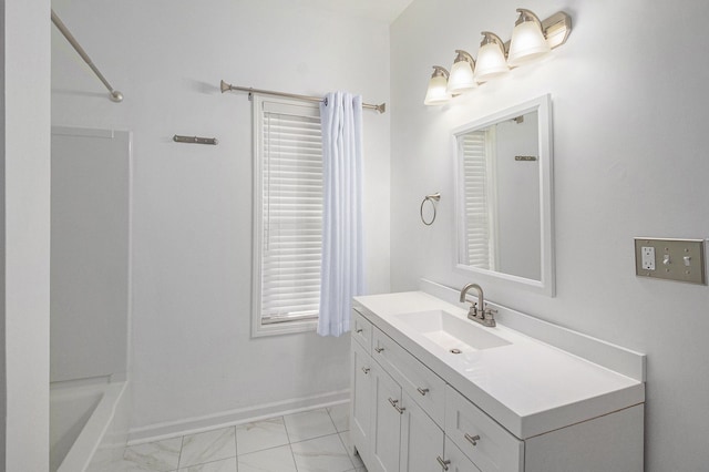 bathroom with plenty of natural light and vanity