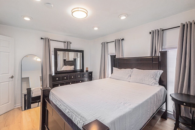 bedroom with light hardwood / wood-style floors