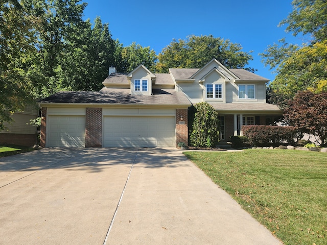 view of front of house with a garage and a front yard