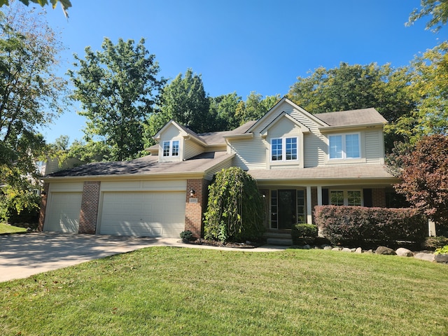 view of front facade featuring a front yard and a garage