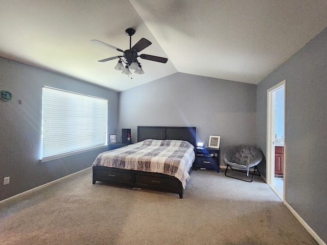 carpeted bedroom with ceiling fan and lofted ceiling