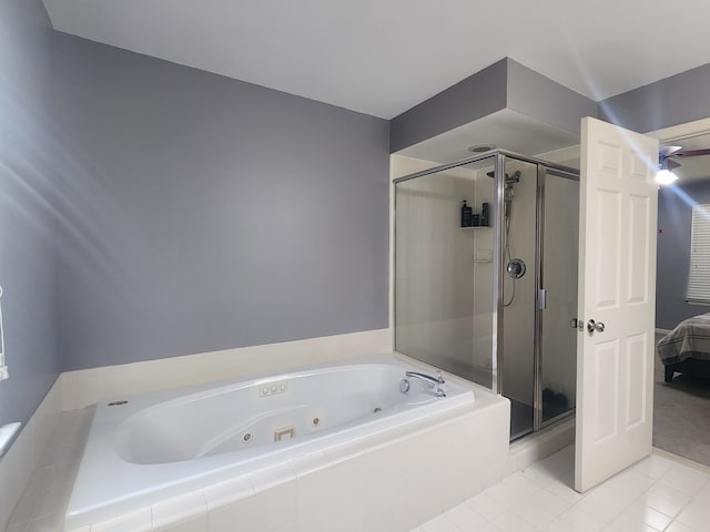 bathroom with tile patterned floors and independent shower and bath