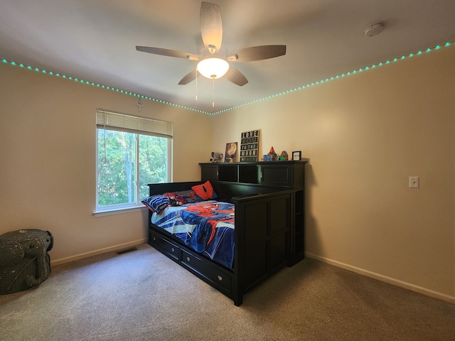 carpeted bedroom featuring ceiling fan