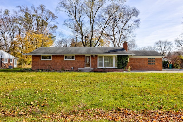 ranch-style house with a front lawn