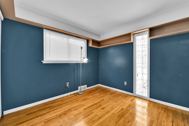 empty room featuring hardwood / wood-style flooring