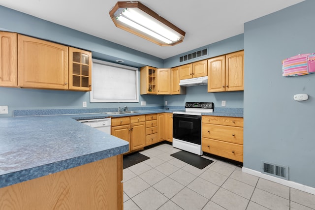 kitchen with light brown cabinets, white appliances, sink, and light tile patterned floors