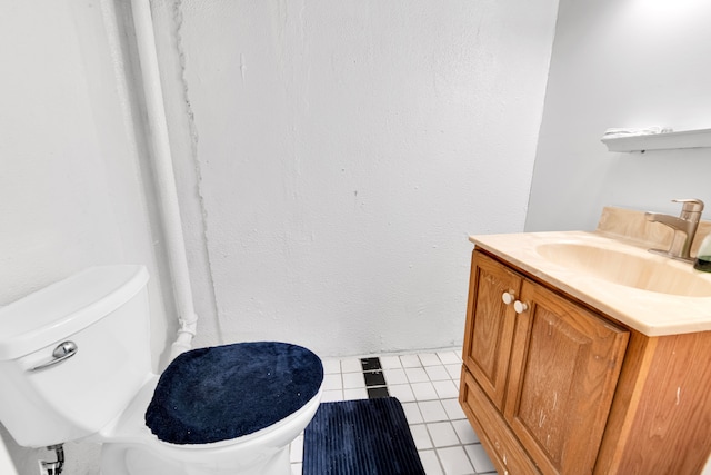 bathroom with tile patterned floors, vanity, and toilet