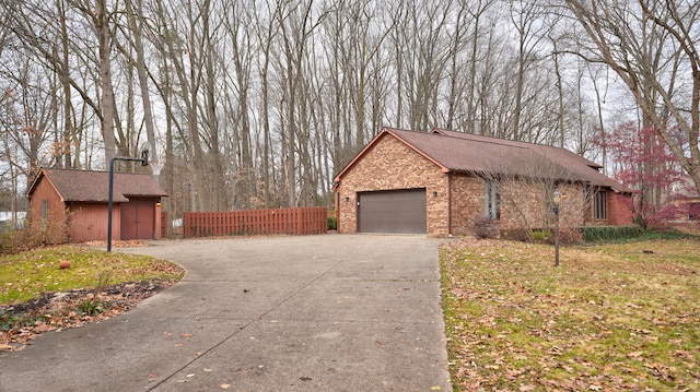 view of home's exterior featuring a yard and a garage