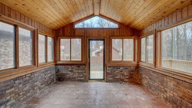 unfurnished sunroom with wood ceiling and lofted ceiling