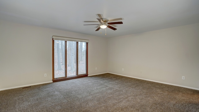 carpeted empty room with ceiling fan