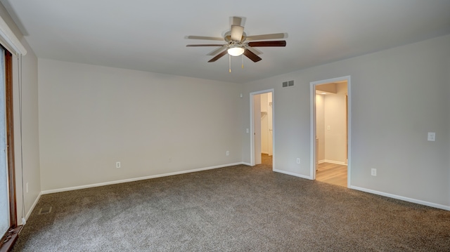 unfurnished bedroom with ceiling fan and carpet floors