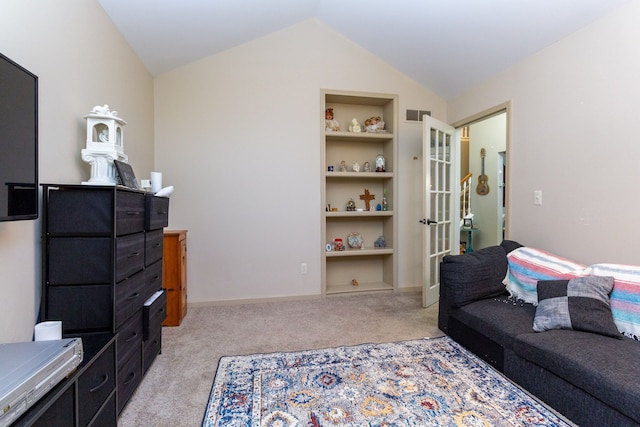 interior space featuring built in shelves and lofted ceiling