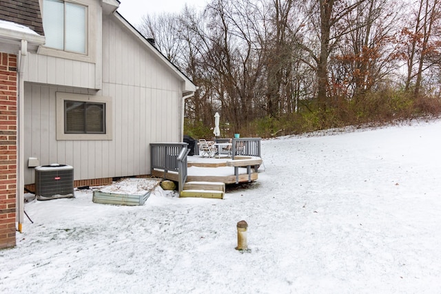 exterior space with a wooden deck and central AC