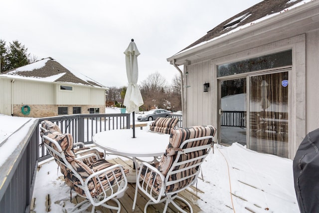 view of snow covered deck