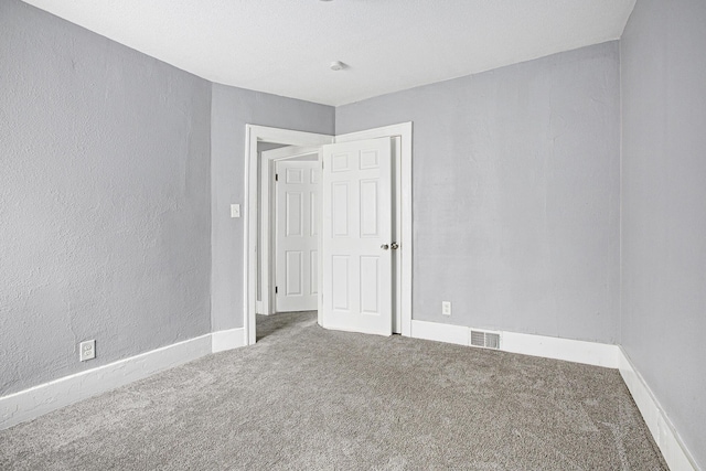 empty room featuring carpet floors