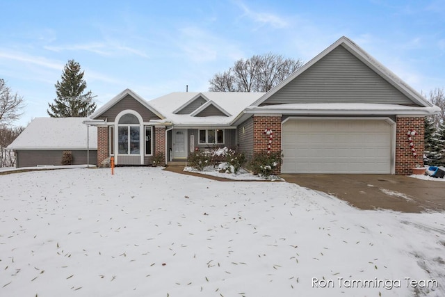 2187 Riley St, Hudsonville, MI 49426 - single story home featuring brick siding, an attached garage, and driveway