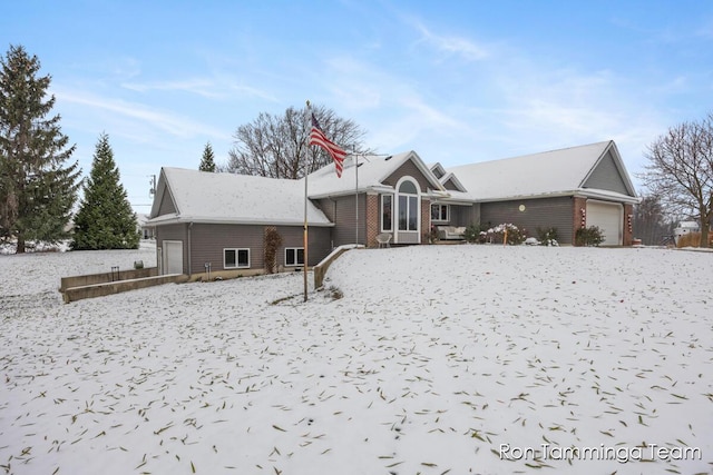 2187 Riley St, Hudsonville, MI 49426 - view of front facade with an attached garage and brick siding