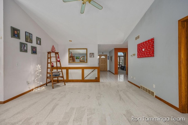 2187 Riley St, Hudsonville, MI 49426 - carpeted empty room featuring vaulted ceiling, ceiling fan, and baseboards