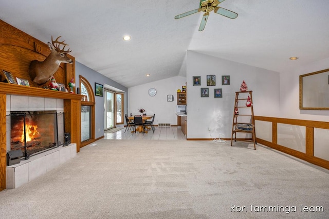 2187 Riley St, Hudsonville, MI 49426 - carpeted living room with vaulted ceiling, a tile fireplace, ceiling fan, recessed lighting, and baseboards
