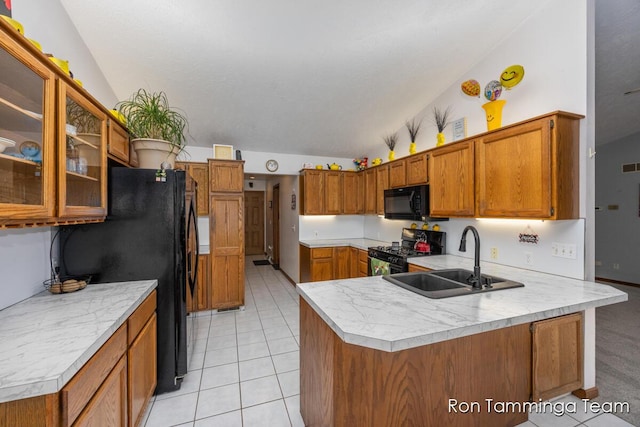 2187 Riley St, Hudsonville, MI 49426 - kitchen featuring a sink, black appliances, a peninsula, brown cabinets, and light countertops