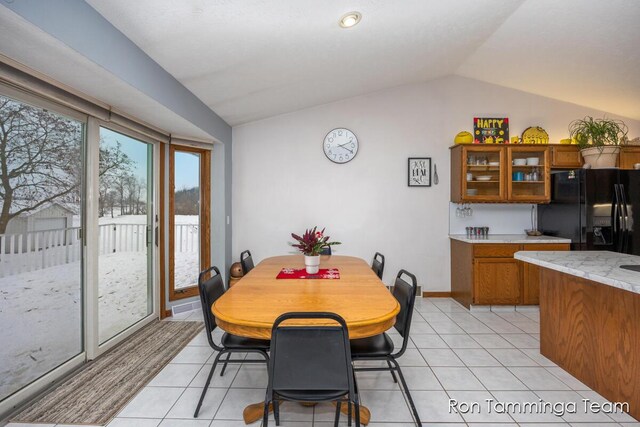 2187 Riley St, Hudsonville, MI 49426 - dining space with vaulted ceiling and light tile patterned floors