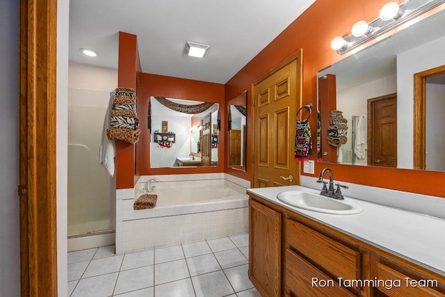 2187 Riley St, Hudsonville, MI 49426 - bathroom with tile patterned flooring, a garden tub, vanity, and a stall shower