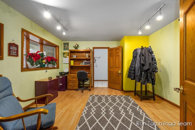 2187 Riley St, Hudsonville, MI 49426 - home office with track lighting, light wood-style flooring, and baseboards