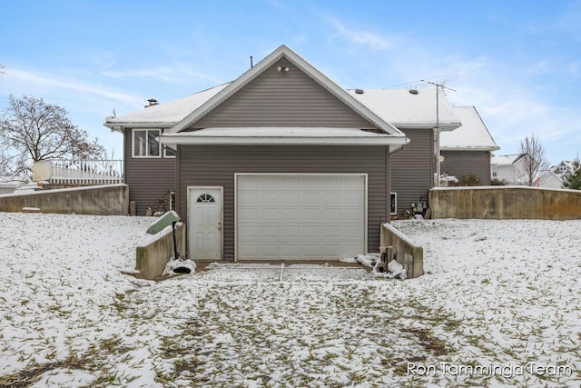 2187 Riley St, Hudsonville, MI 49426 - view of snowy exterior featuring a garage