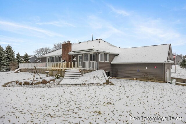 2187 Riley St, Hudsonville, MI 49426 - snow covered property featuring a deck