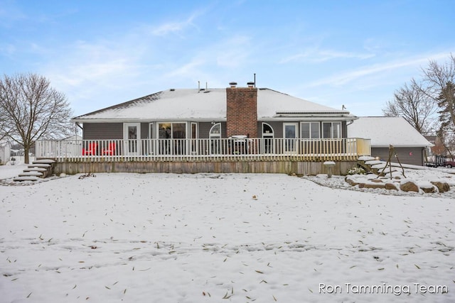2187 Riley St, Hudsonville, MI 49426 - snow covered house with a chimney and an attached garage
